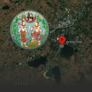 Satellite map with a red location pin near a lake, overlaid by a circular Thai artwork depicting two mythic figures among greenery.